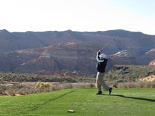 The stunning red cliffs act as a background as Tom takes dead aim on the 12th hole at The Ledges