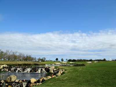 Attractive waterfalls cascade down the left side of the hole