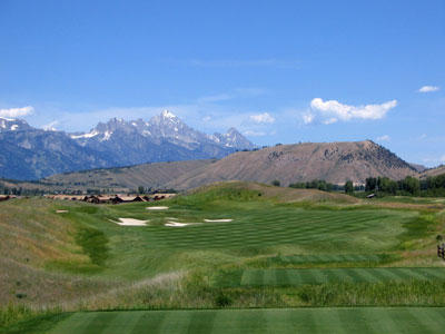 The Tetons loom in the distance of this impressive par four