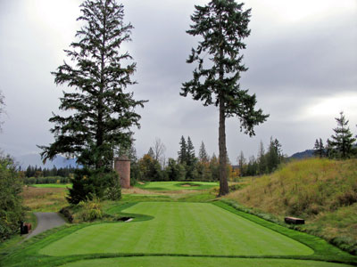 An old silo sits off to the left of this picturesque and difficult hole
