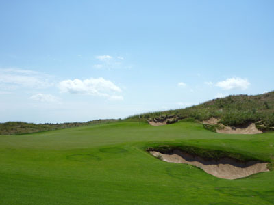 The 16th hole takes a hard turn left and climbs to a wonderful green site