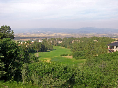 From the highest point of the course, Castle Pines' 1st tee affords big views and a big 150 foot drop to the fairway