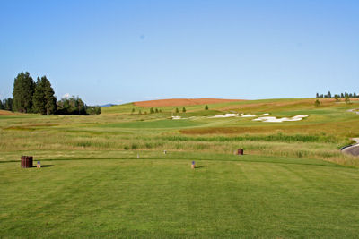 Expansive bunkers through the middle of this hole create a split fairway and options for the golfer