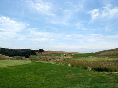 A big time par five that curls down the hill